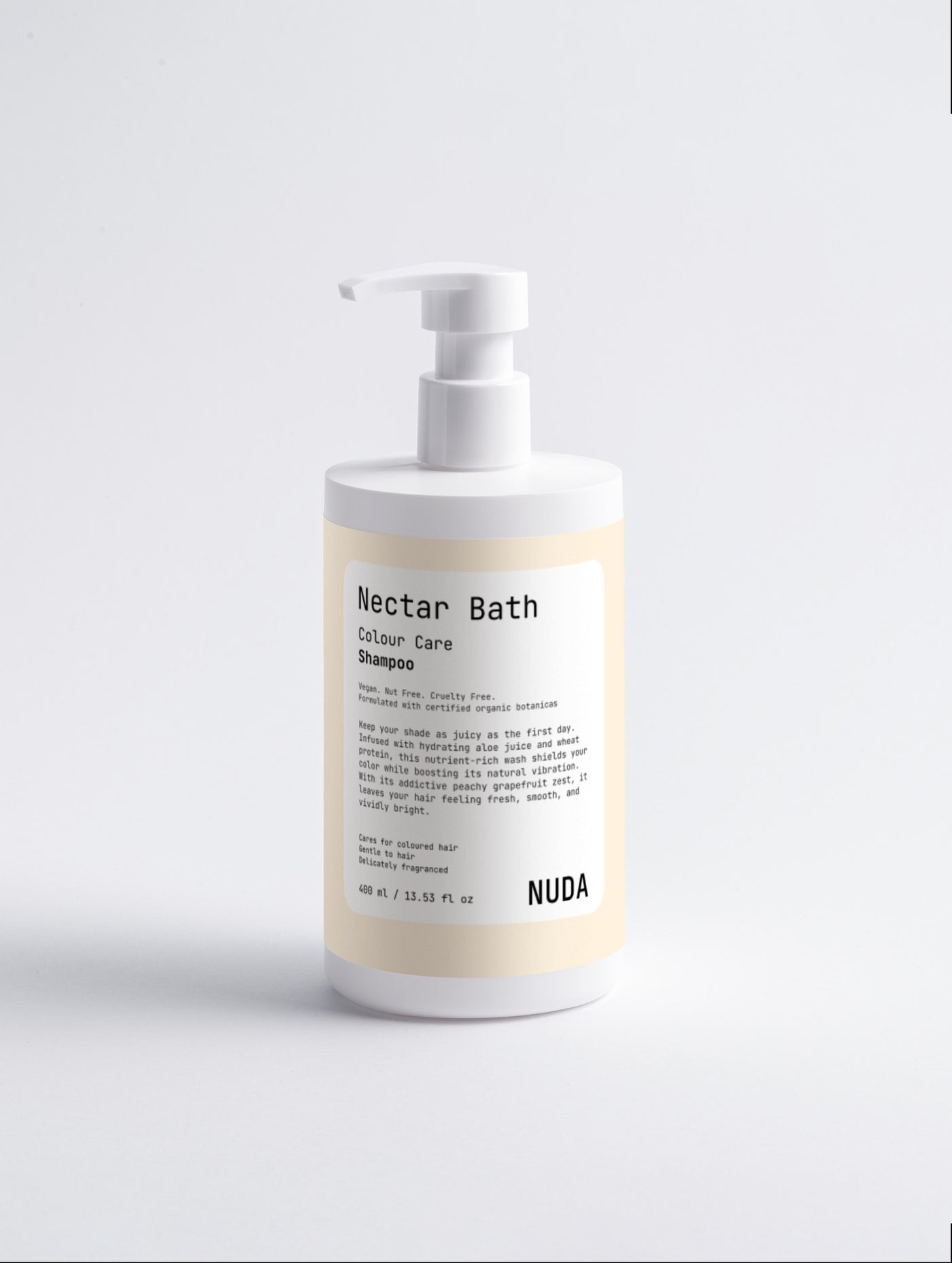 NUDA certified shampoo bottle with its INCI ingredient list