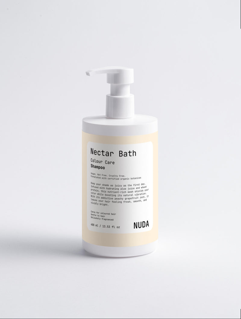 NUDA Nectar Bath colour care shampoo bottle with pump, a gentle cleansing formula