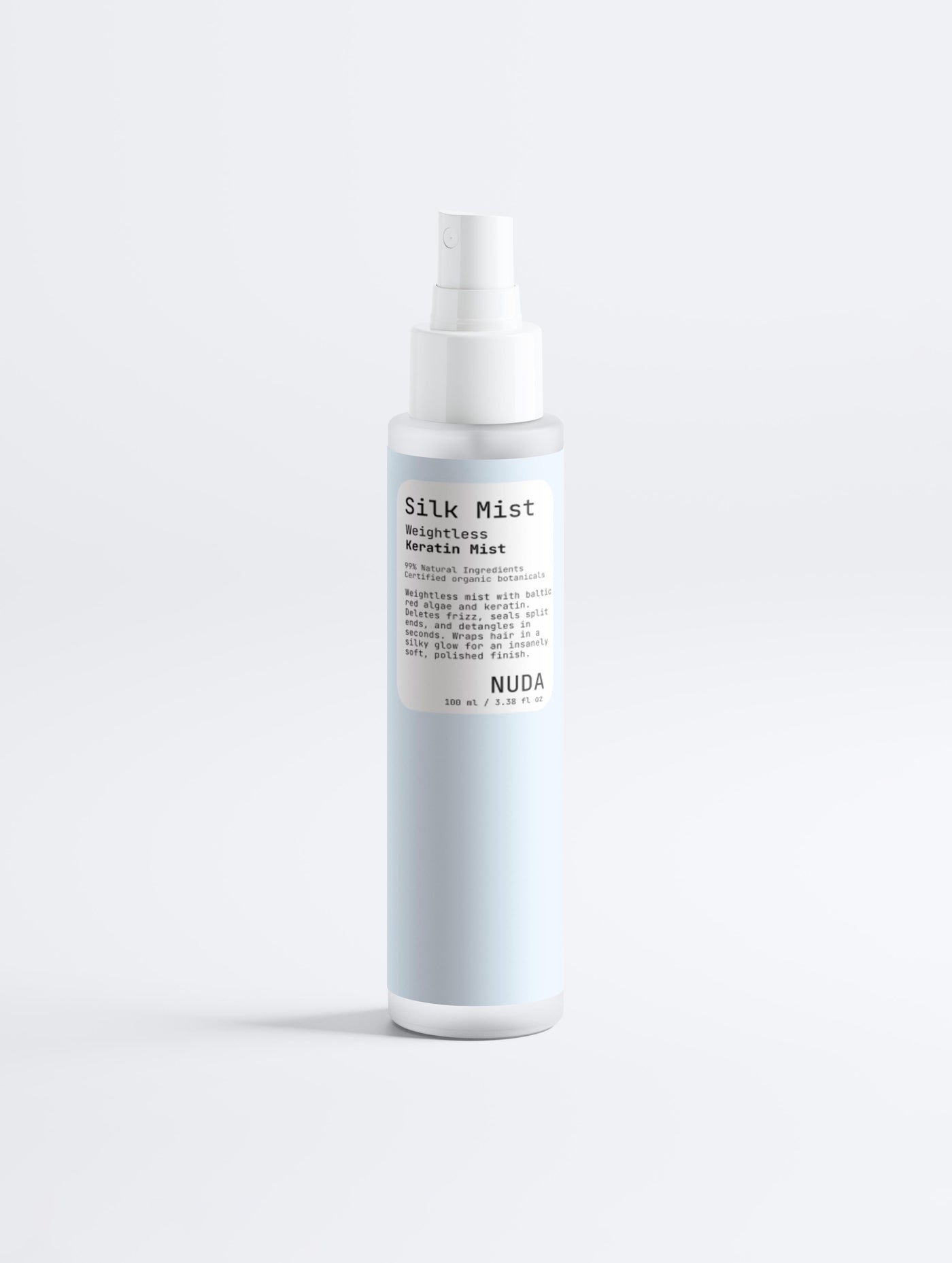 NUDA Silk Mist weightless keratin mist in a pale blue spray bottle