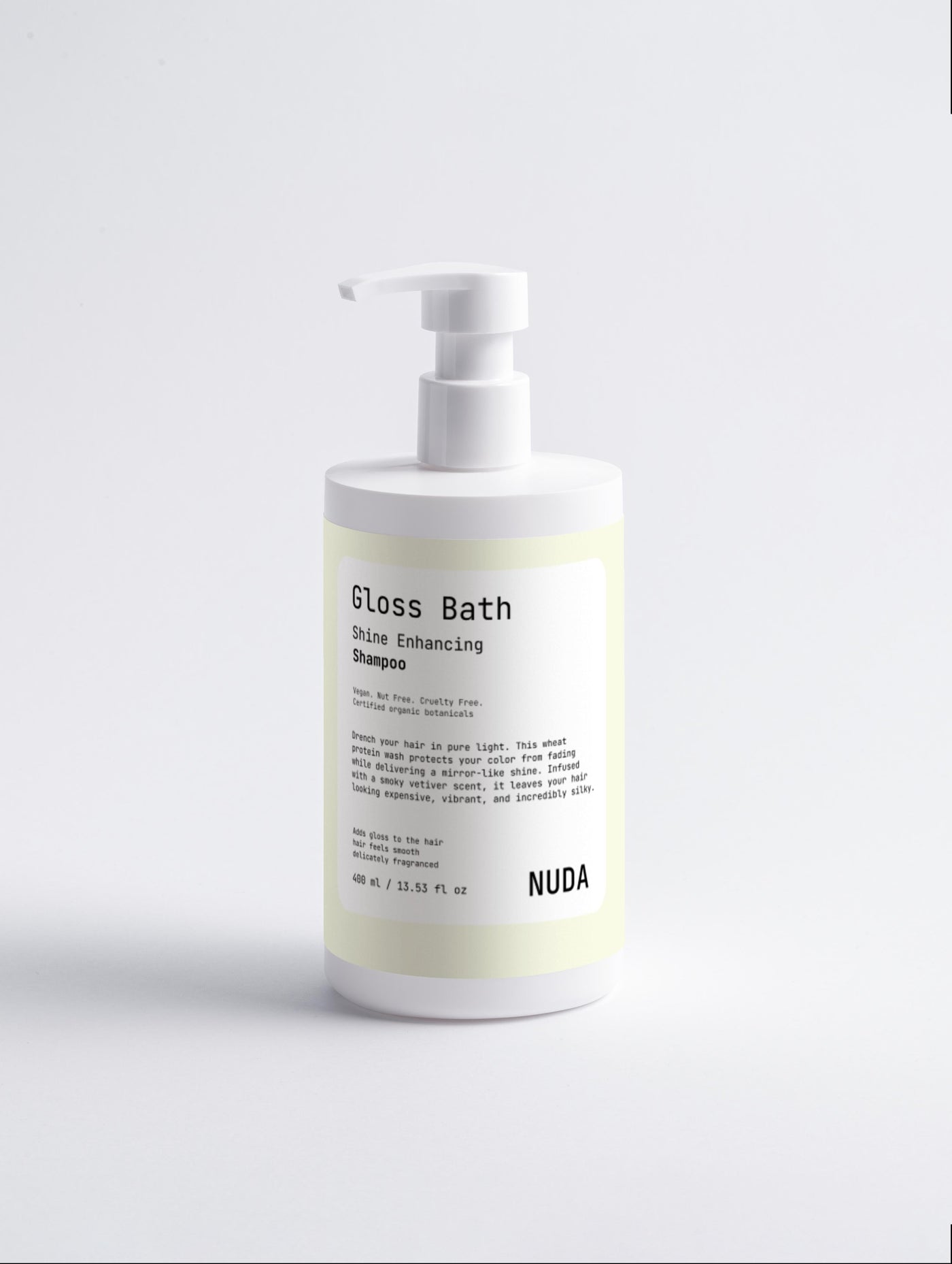 NUDA Gloss Bath shine enhancing shampoo bottle with certified organic botanicals