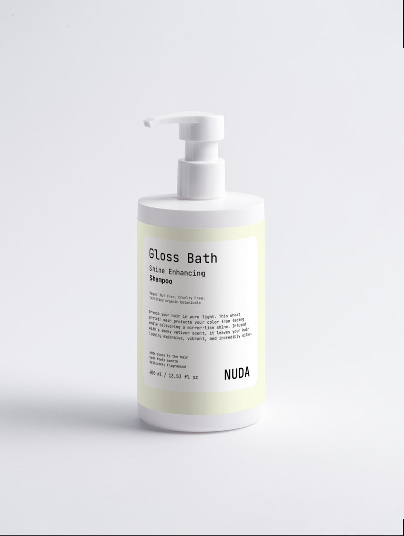 NUDA Gloss Bath shine enhancing shampoo, used to bring shine back to dull hair